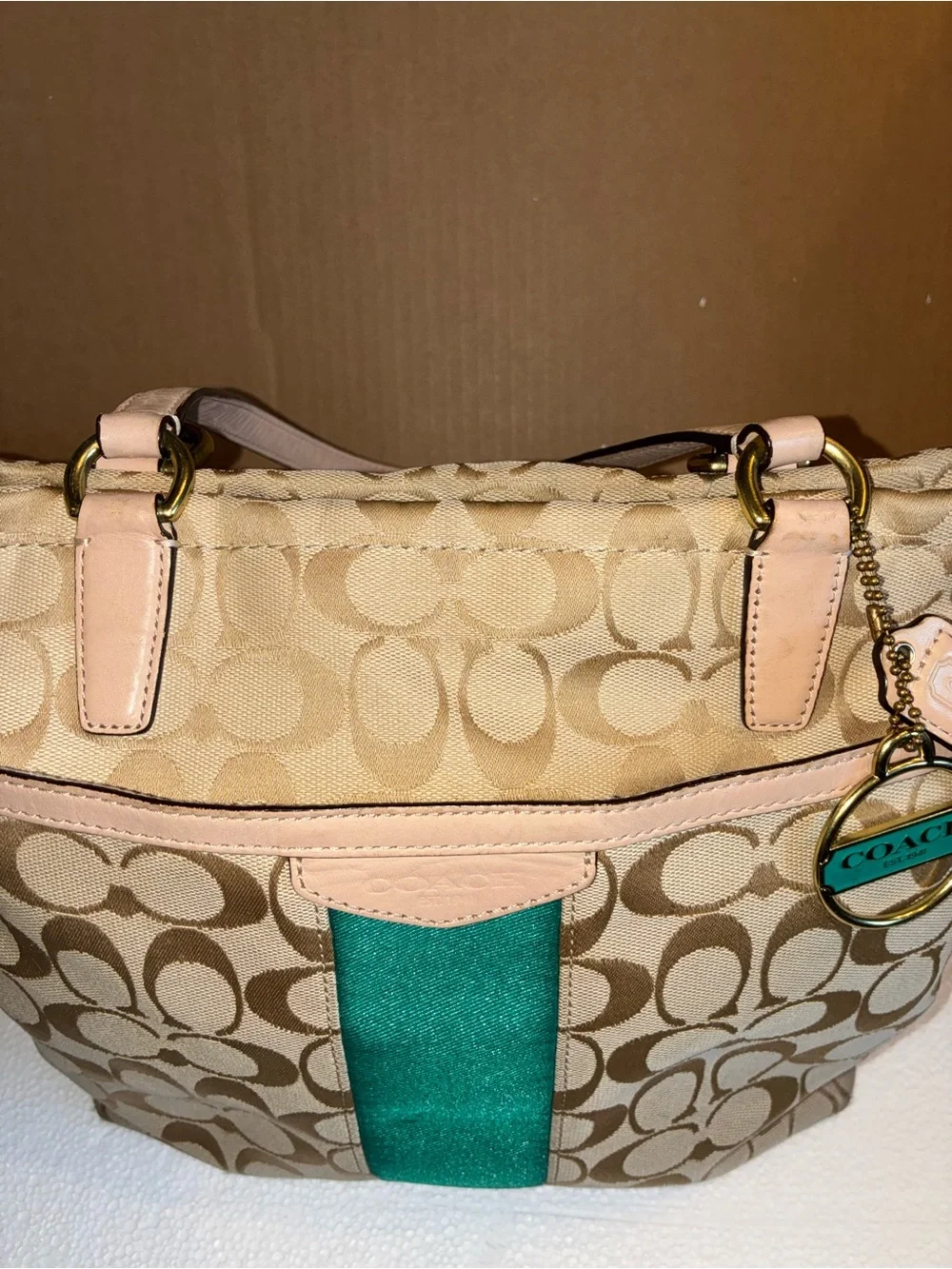COACH Beige Signature Tote with Teal Center Stripe.